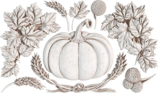 Clay castings from the IOD Autumn Cottage mould, featuring a pumpkin and fall leaves.