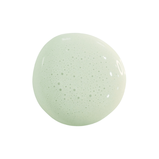 A dollop of milk paint in the shade Sweetwater up against a white background.