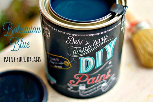 A can of DIY Paint Co. chalk paint in Bohemian Blue color, with text and graphic designs on the label.