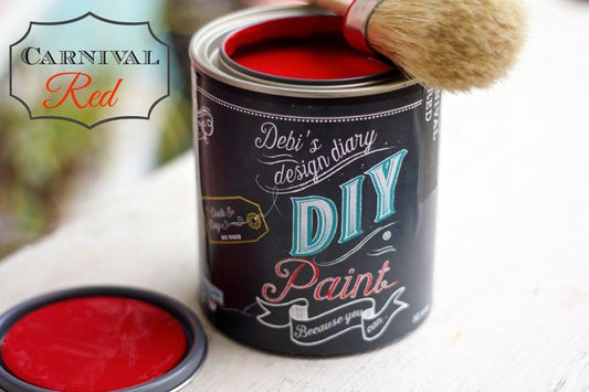 A can of Carnival Red DIY paint with a brush next to it, indicating a red color for the paint.