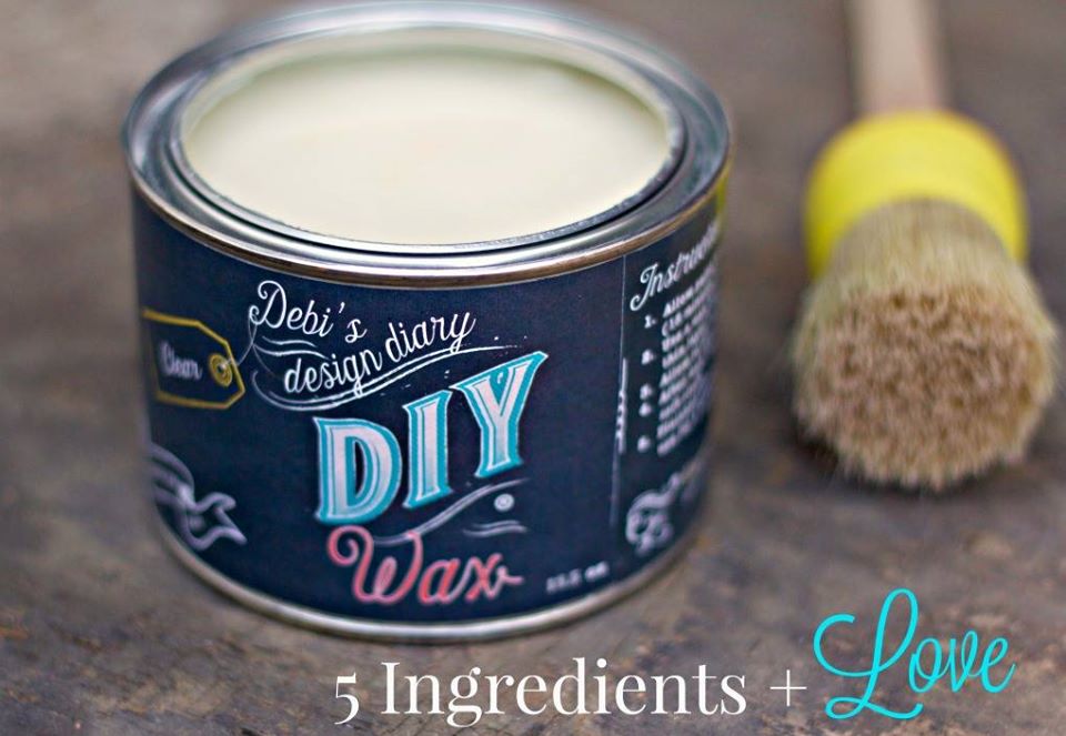 An open can of clear furniture wax with a label reading "Debi's Design Diary DIY Wax", with a brush laying beside it and a text that reads "5 ingredients + Love".