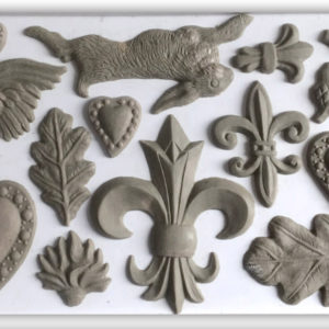 Clay castings of fleurs, leaves, a rabbit, and hearts using the "Fleur de Lis' mould from IOD