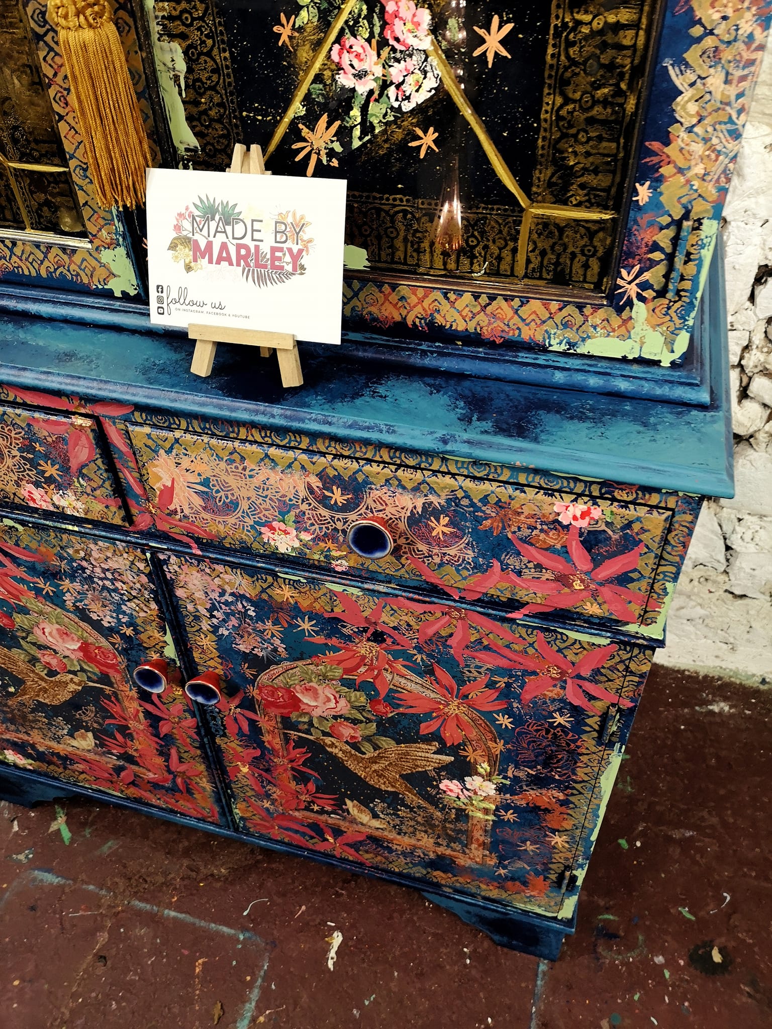 An example cupboard decorated with Made by Marley's "Night Out" decoupage paper.