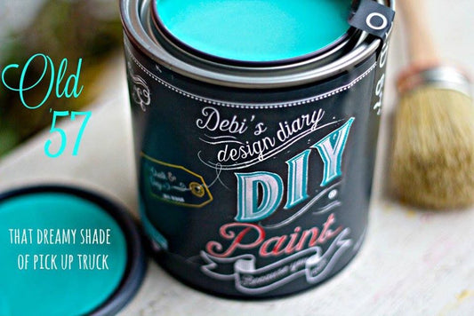 Open can of Old 57 teal chalk paint displaying classic blue teal color