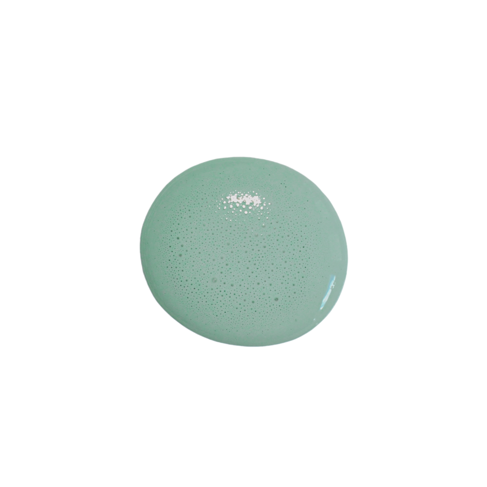 A swatch of Sweet Pickins Milk Paint in a gray-green color, applied on a surface and viewed from a top angle