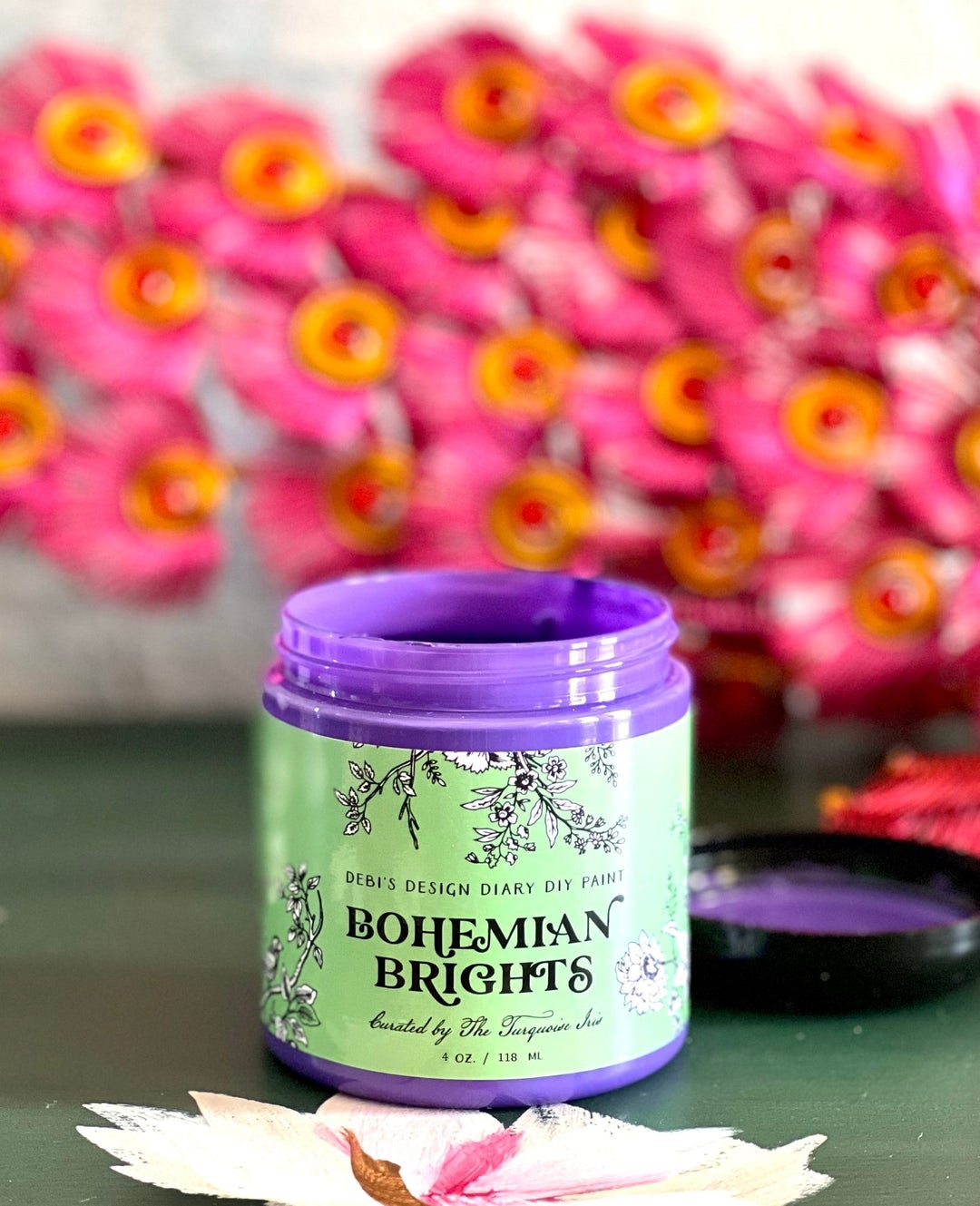 A 4oz container of 'Bohemian Brights' craft paint in purple color, with a label that includes the product name and the Turquoise Iris brand logo.