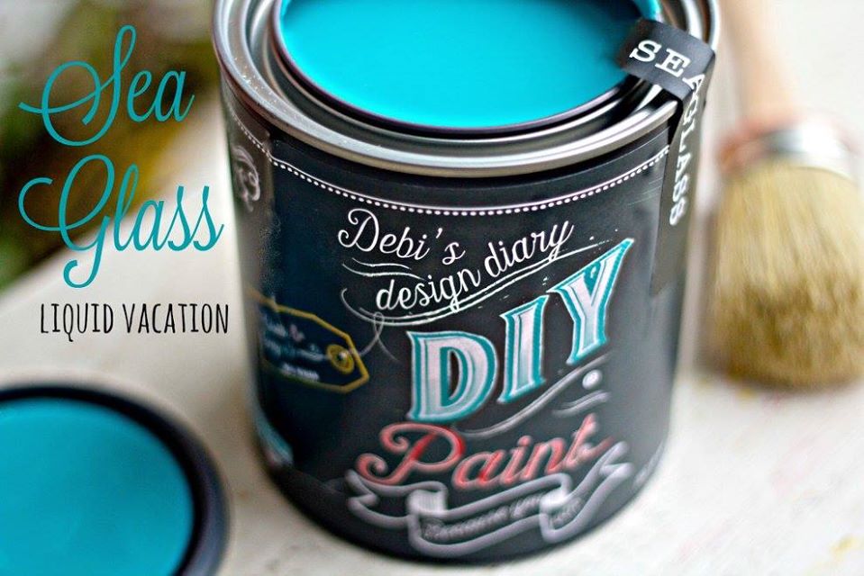 An open pint of "Seaglass" teal chalk paint with the phrase "Liquid Vacation" next to it